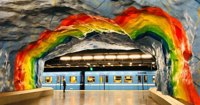 Arched rainbow painted in the metro at Stadium, Stockholm