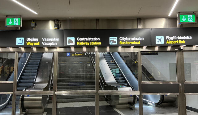 A picture of sings in a train station